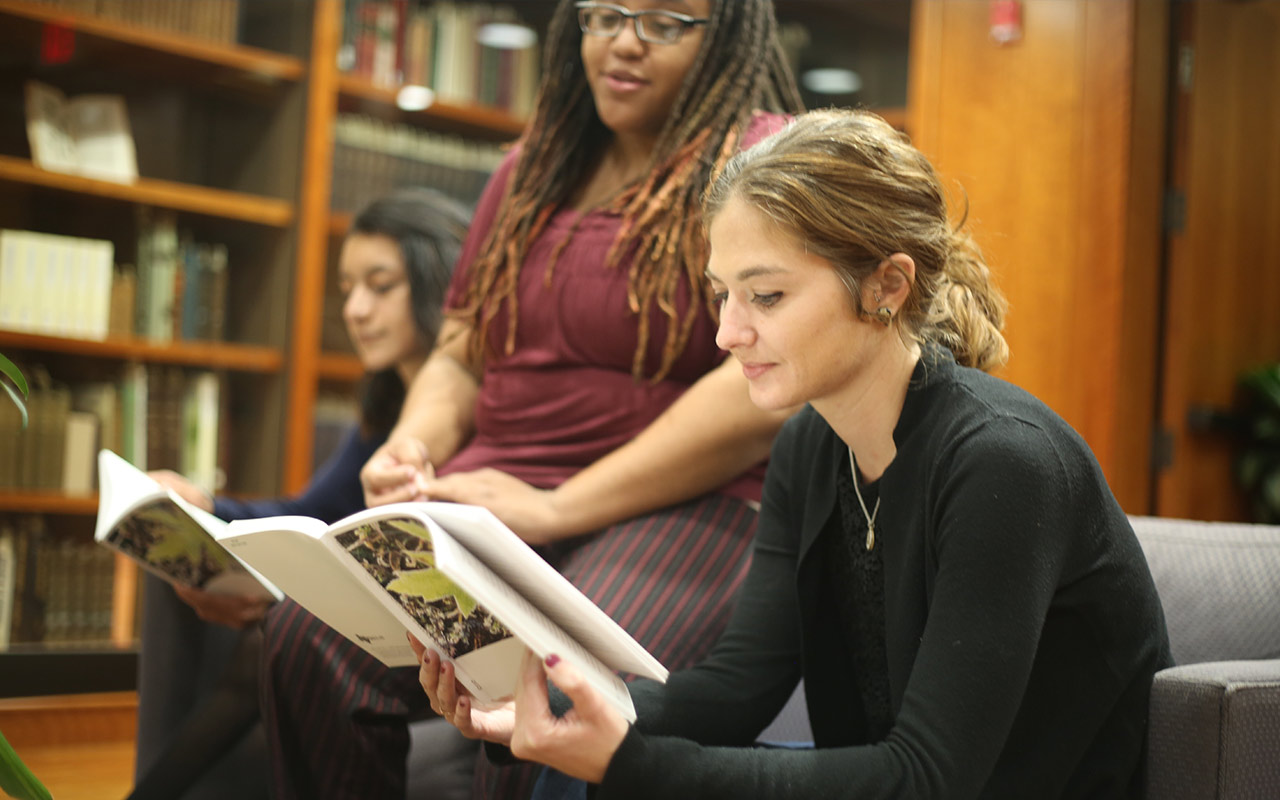 Students reading at a discussion session