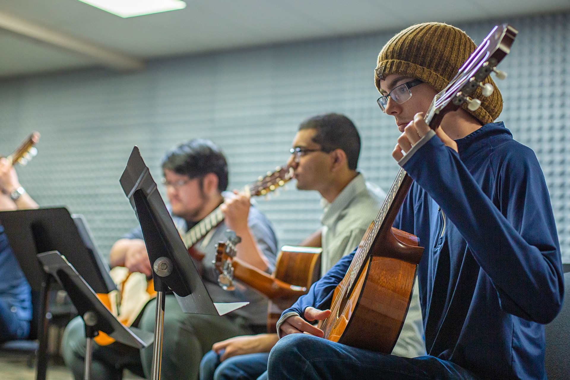 Students in the UT Dallas Guitar Studies program practice in the studio.