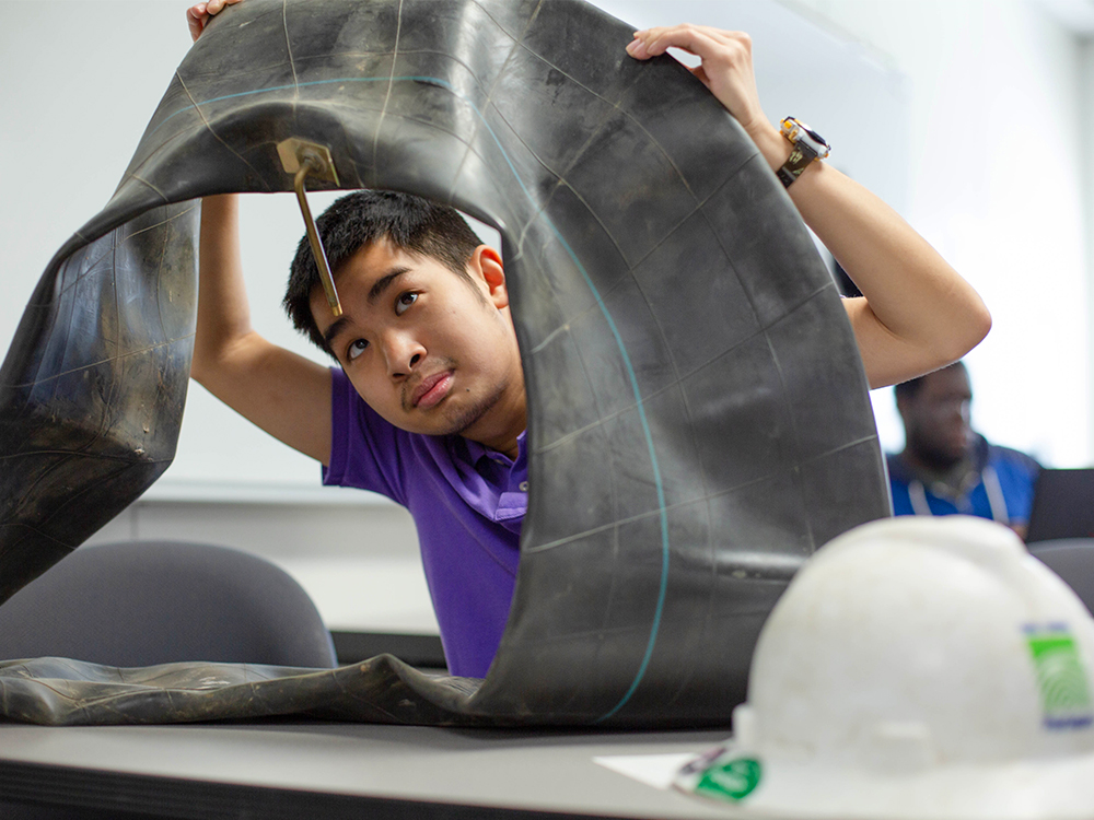 A student with a large inner tube