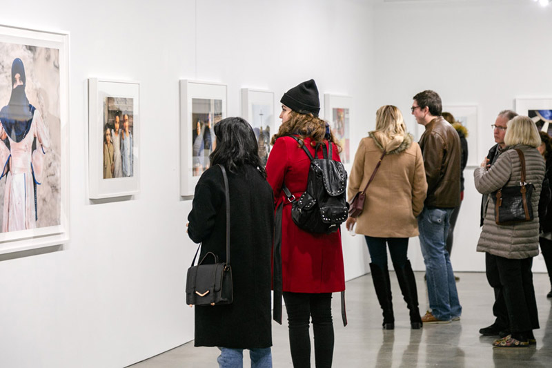 Students looking at an art gallery display