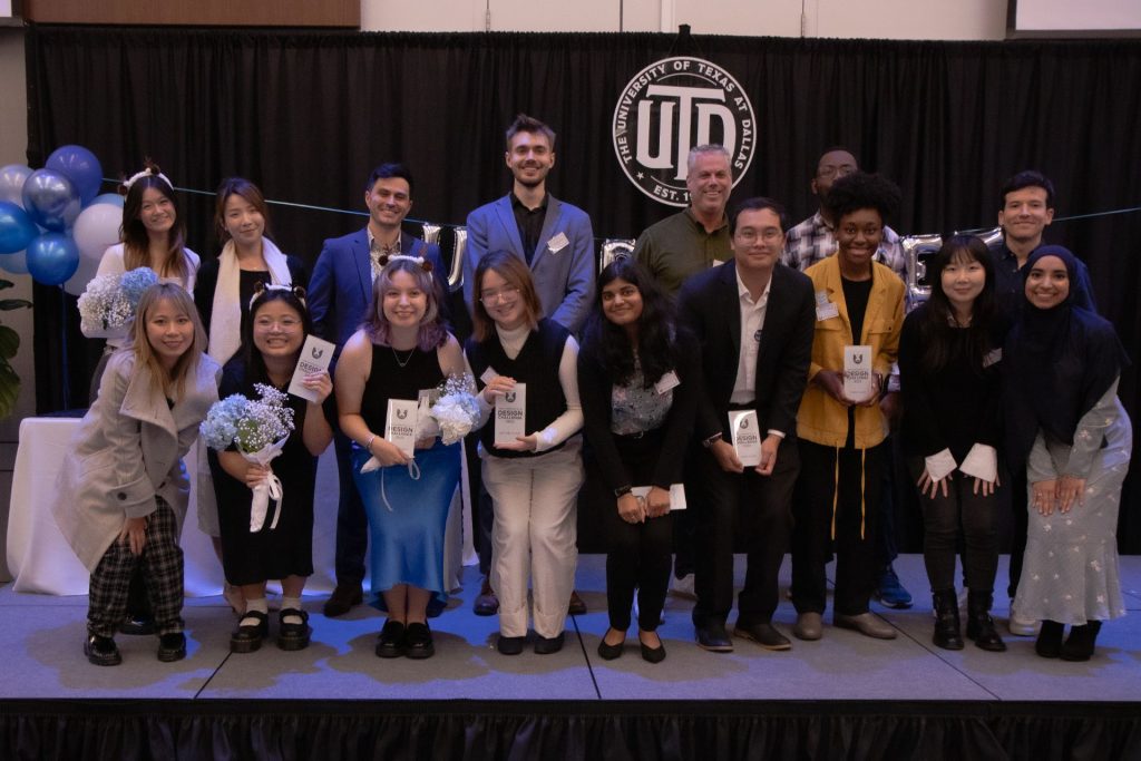 The selected participating teams, holding their plaques, posed with the judges and the President of the UX Club on the stage.