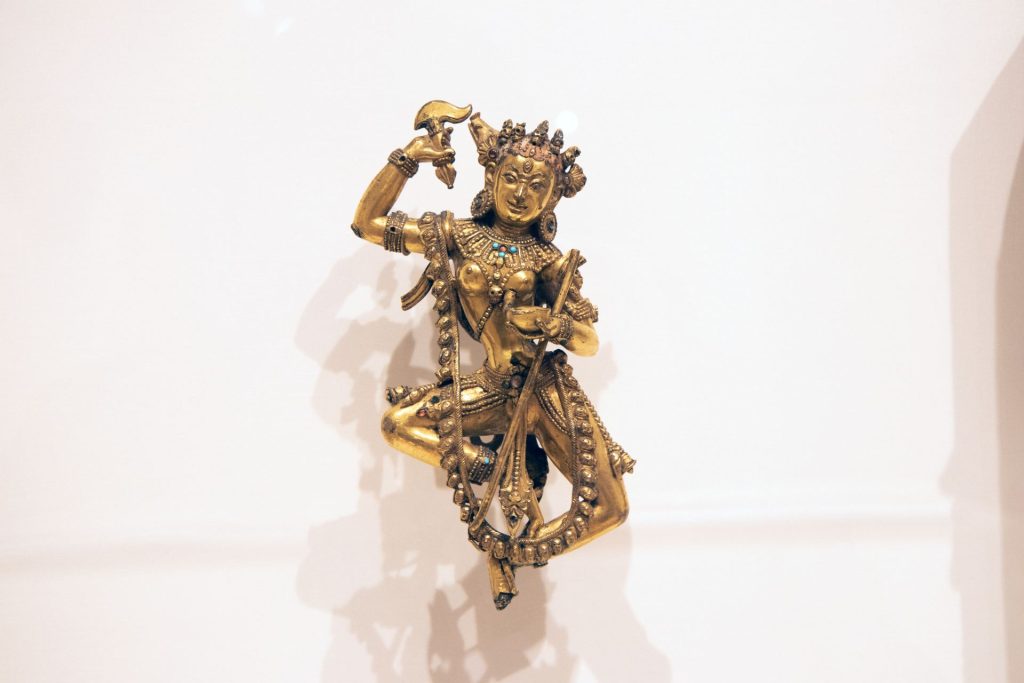 Vajravarahi, a gilt bronze sculpture with semiprecious stones and traces of pigment, sculpted in Tibet in the 18th century.
