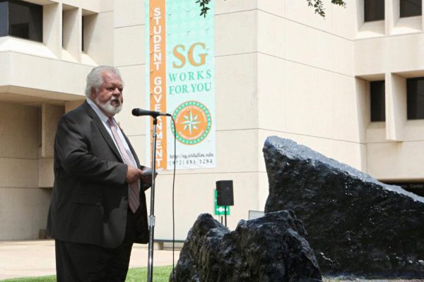 Dr. Tom Linehan addressing a crowd of nearly 350 who had gathered near Spirit Rocks, outside the UT Dallas Activity Center, on July 11, 2012.